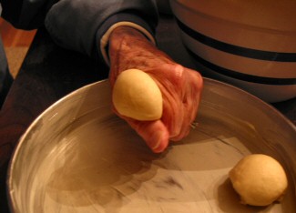 Dinner Rolls being squeezed out